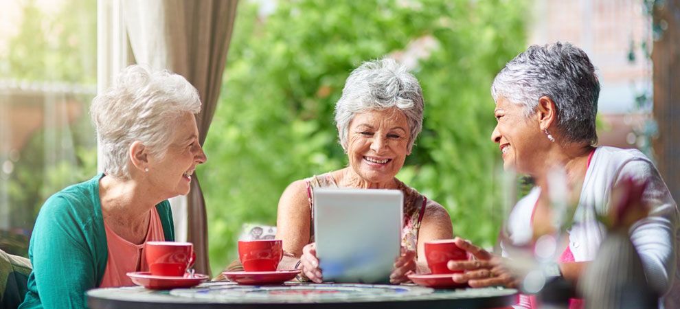 Elderly woman using an iPad