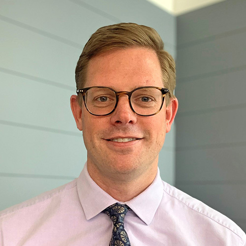 Image of CFO, Andrew Grayson, smiling at the camera