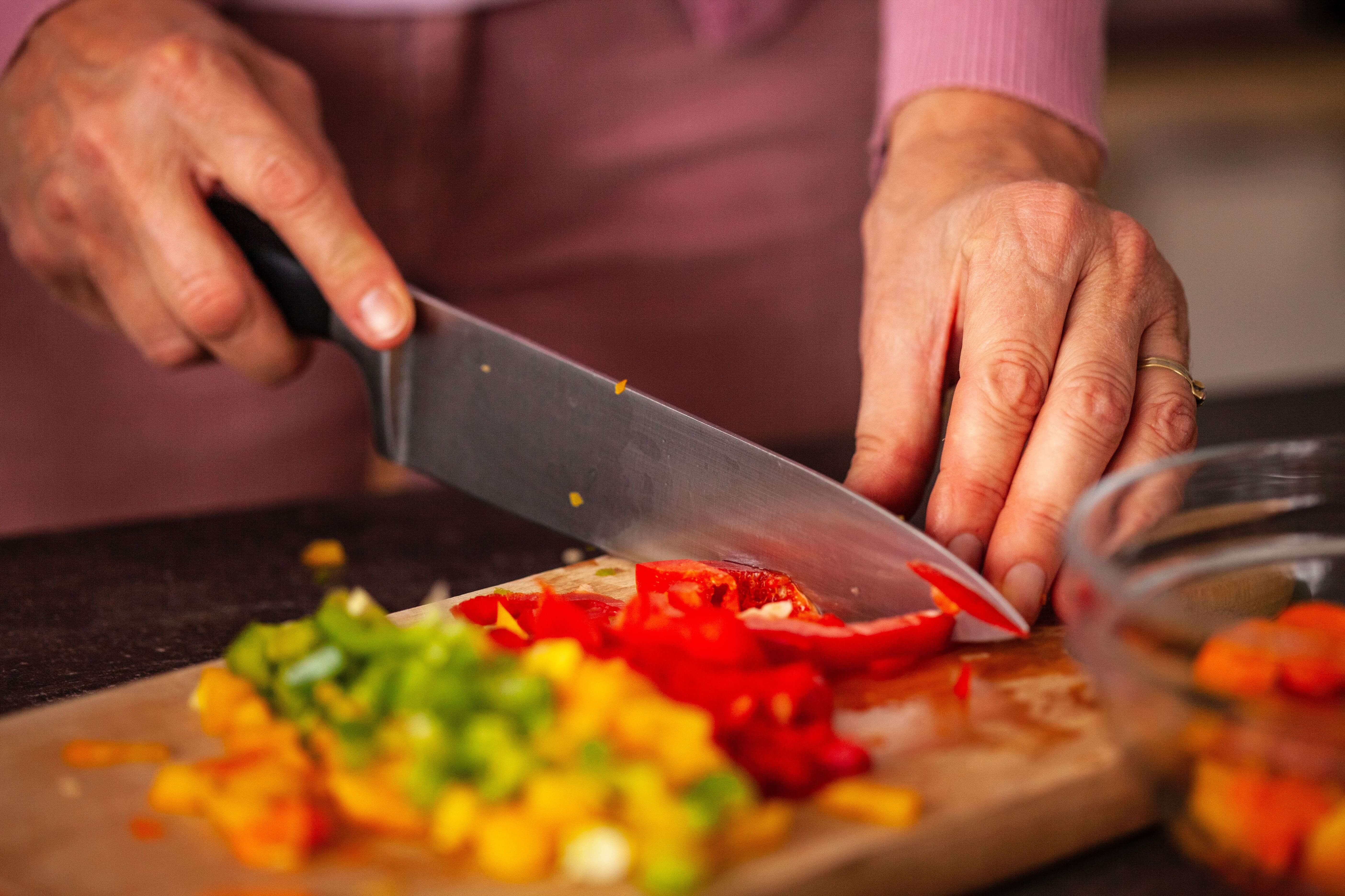 Someone is chopping vegetables