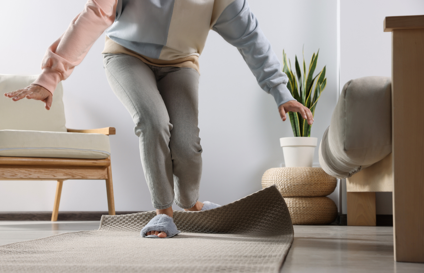 older person tripping over a floor rug